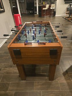 Foosball Table with Blue and Red Players