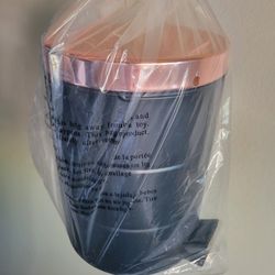 Brand new bathroom trash can with foot push.