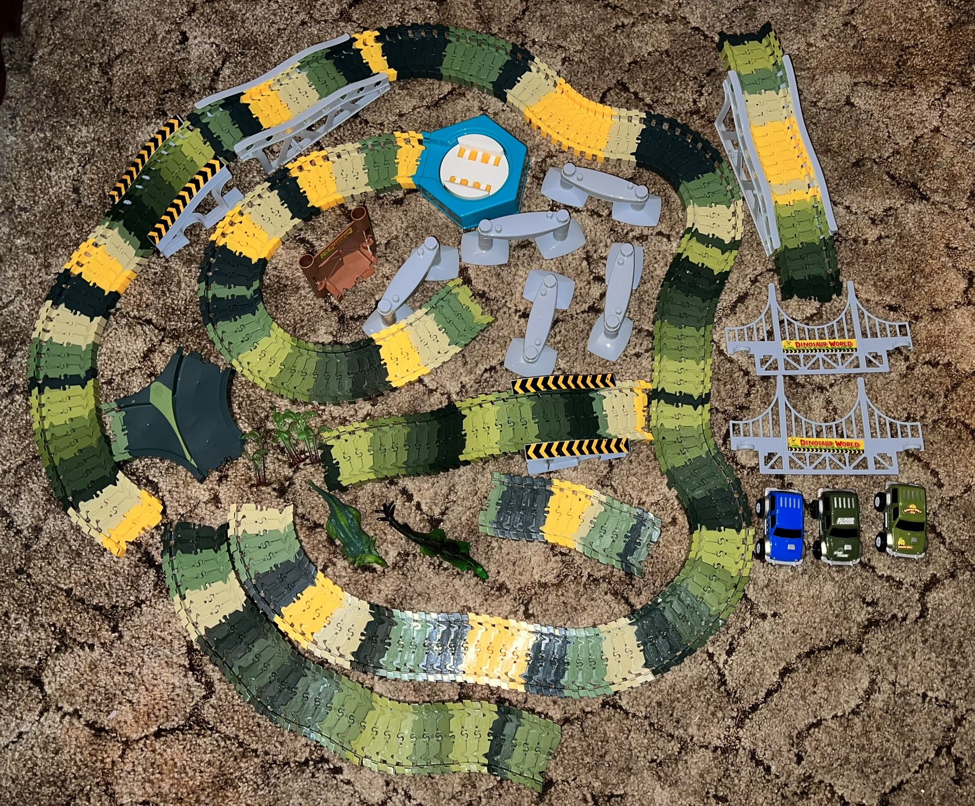Dinosaur Flexible Race Track w/ Motorized Turntable and Dinosaur Adventure Playset (2 different sets)