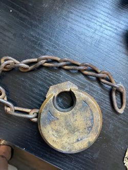 Heavy old school lock on a chain