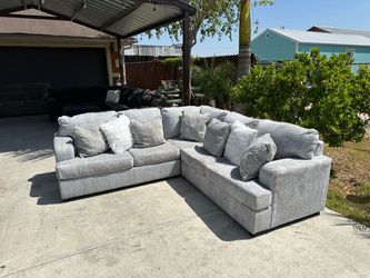 Beautiful modern lite grey sectional super comfy and soft material all pillows included must see asking 650