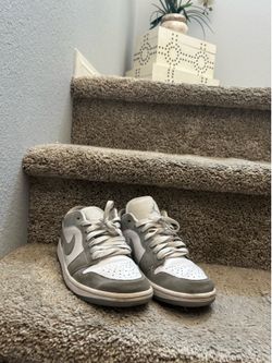 Woman’s grey and white Jordan dunks size 7 us