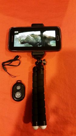 Tripod stand phone or camera holder with remote shutter.