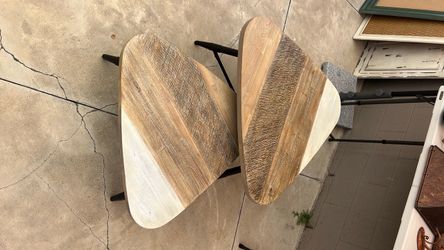Two triangular nesting tables