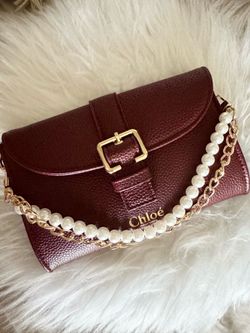 Chloe small burgundy clutch with attached gold chain