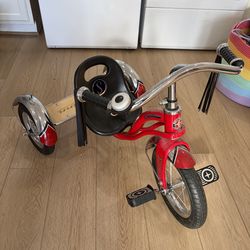 Red Schwinn Roadster Tricycle