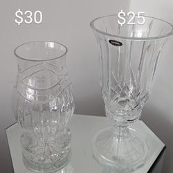  Two very beautiful crystal candle holders, both made of two pieces...one of them is new with box and the other is like new