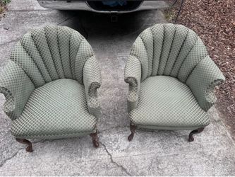 A pair of tub chairs