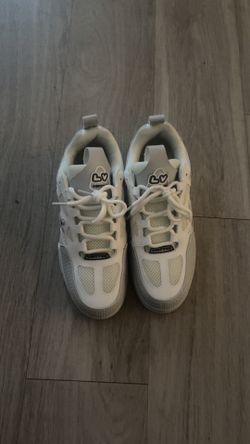 Grey and white Lv skates
