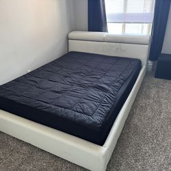 queen-size mattress, bed, and chair.