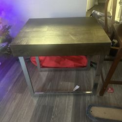 Matching Brown Tables With Silver Legs 