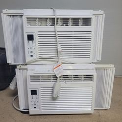 Two GE, 6000 BTUs window ACs with 2 remotes