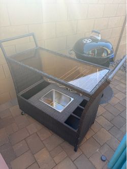 Rolling rattan bar cart