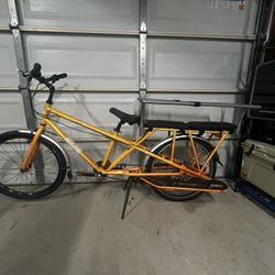 Yuba Mundo non-electric cargo bike in orange