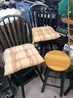 Wooden bar stools with cushions