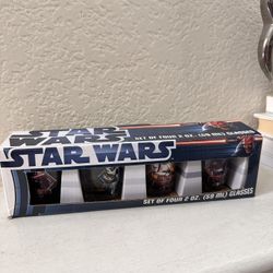 a set of four Star Wars character shot glasses.