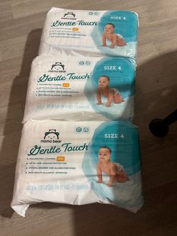 Three packs of new diapers