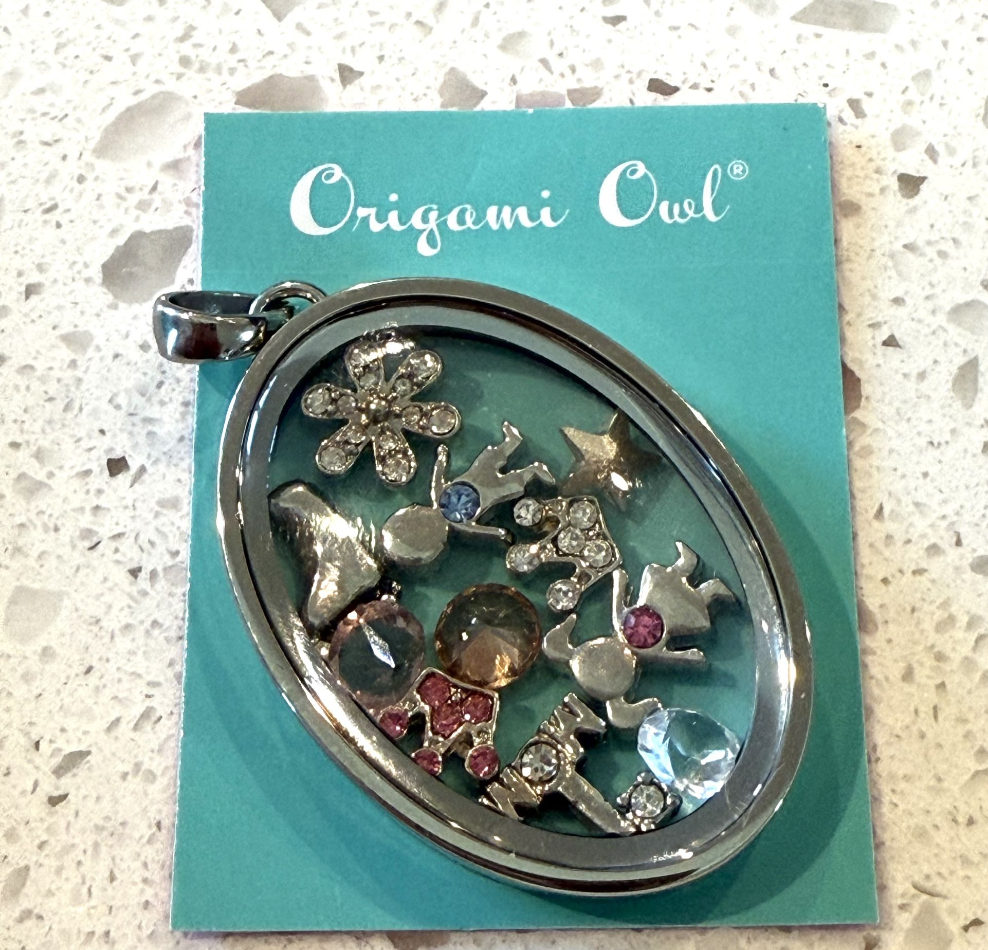 New Origami Owl Heirloom Silver Hinged Oval Living Locket Mother’s Day Gift NIB Boy Girl Only 1 available 11 floating charms. Locket opens