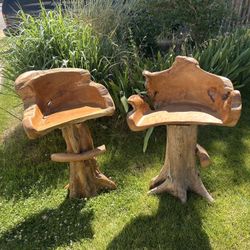Two carved wood barstools