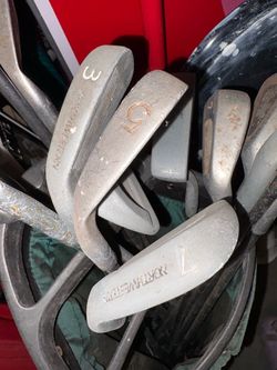 over 15 assorted golf clubs with 2 bags free