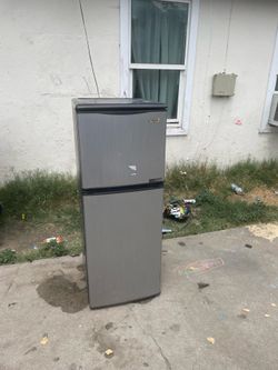 Black and grey magic chef mini fridge