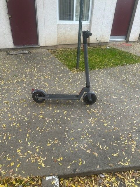Used upgraded electric scooter With two solid tires.