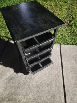 black rolling salon or utility trolley cart