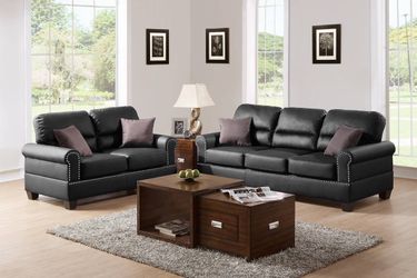 Black faux leather sofa and love seat set