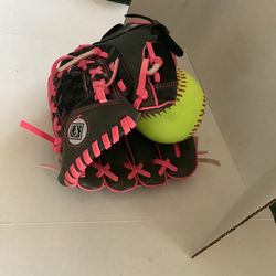 Girls fastpitch 11” softball glove, pink laces with 2 softballs like new condition,  catch with right hand throw with left Plainfield, Illinois