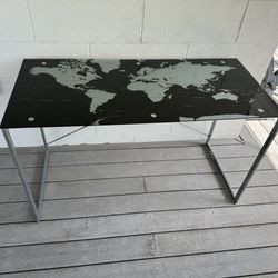 World Map Desk. 51 x 24D x 30H  Glass top with metal base. In great condition. 