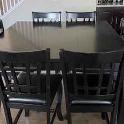Black Wooden Expandable Dining Counter Height Table with Faux Leather Chairs