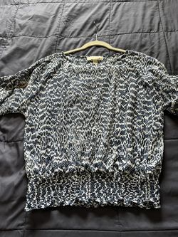 It’s A Beautiful Blouse From Michael Kors The Color Is White And Navy Blue. The Size Is Medium.