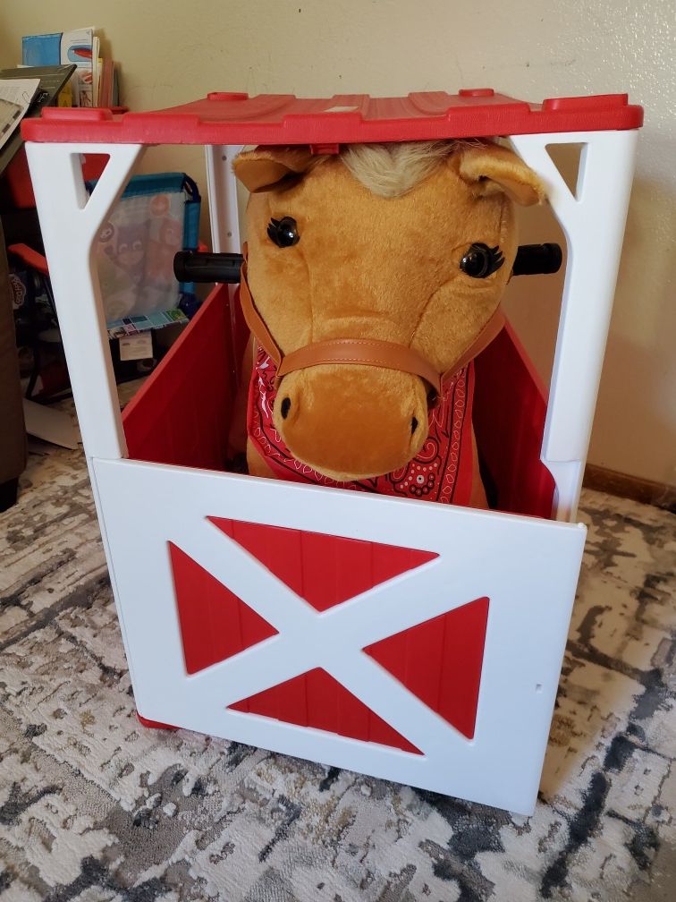 Kids riding horse with stable