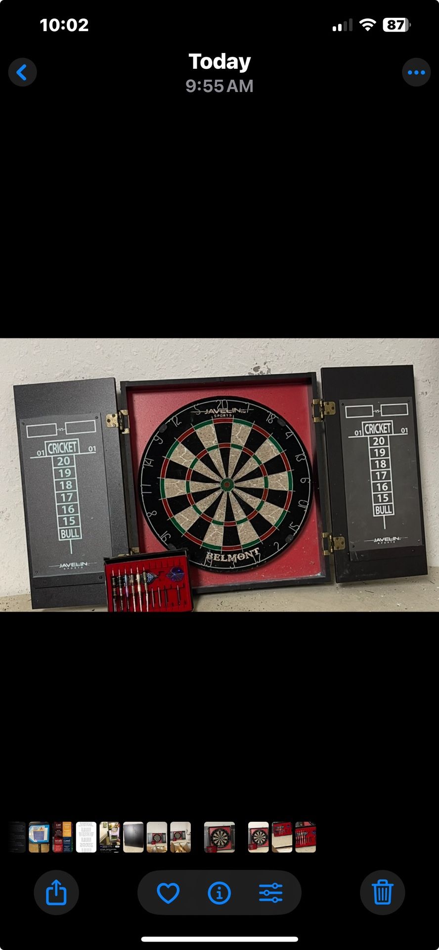 Dart board within a cabinet