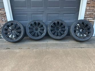 24in rims with tires 305/35R24 with lug nuts .