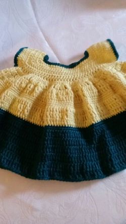 Baby girl dress, hand crafted, with acrylic yarns, new, fits 6months and up, color soft yellow and pagoda green.