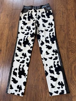Brand new Stylish cow print pants with black leather accents. Just $12.