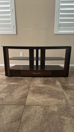Tv stand with glass shelf and lower drawer