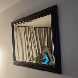 Espejo rectangular de pared.