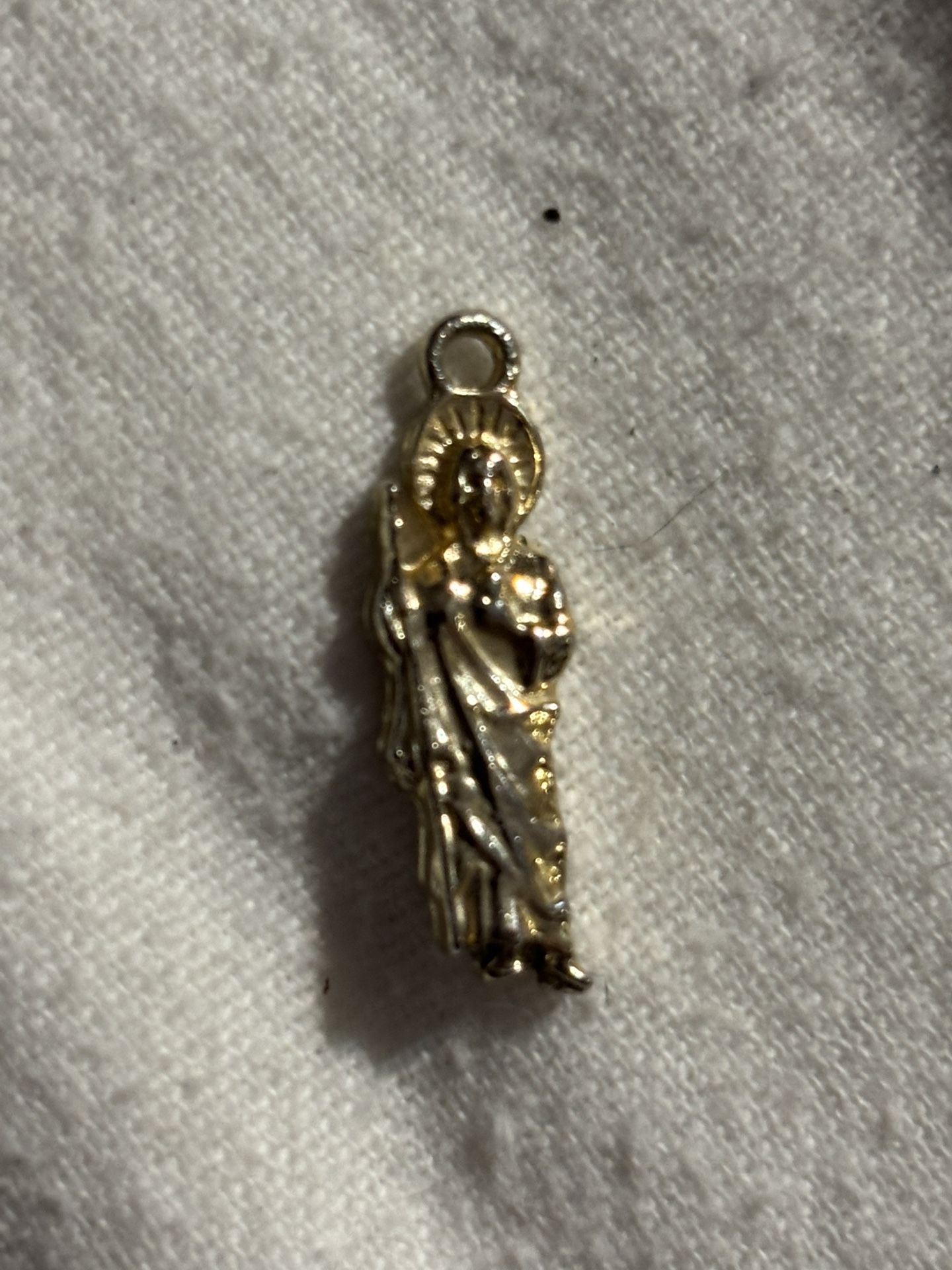 2 Silver, 1 Wooden Cross Pendant. 1 Gold Religious Pendant 