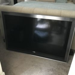 52 Inch Sony TV with cable cord and remote.