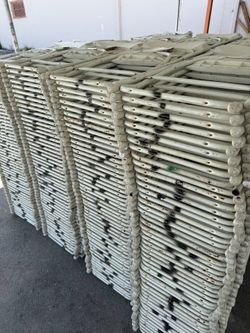 Used white folding chairs s,a,l,e
