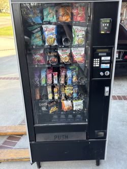 2 snack machines with card readers and pallet jack