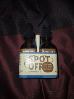 Spot Off Photo Print and Negative Retouching Liquid in 2 fl oz bottles.