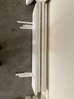 4 white wooden shelves
