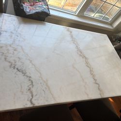 Dinning table marble  Moving sale also have sectional couch for sale 
