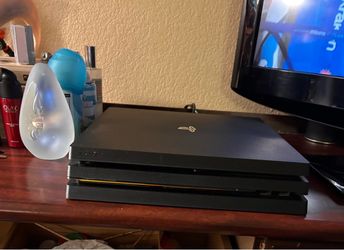 PlayStation 4 with two controllers and 9 games