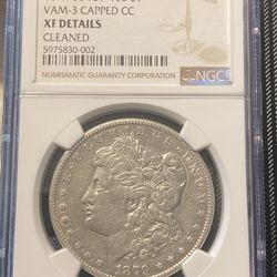 Various graded Morgan Silver Dollars