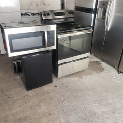 electric stove..fridge  and microwave  ..new microwave in box  and new Ge electric  stove  and use fridge..all stainless  1275