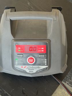 That is a Schumacher battery charger/engine starter, model SC1321. The exact model is a 6V/12V automatic charger, with 6A charging capability.